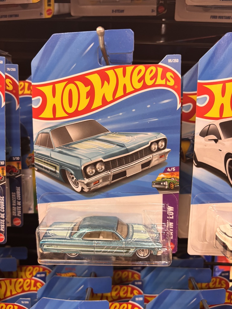 A carded die-cast Impala hanging on a store peg